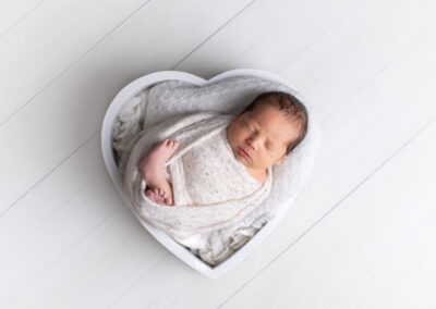 Newborn baby in heart posing