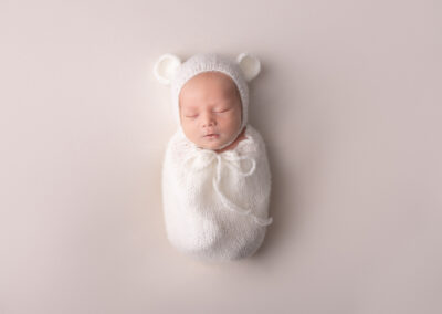 Newborn baby wearing bear hat