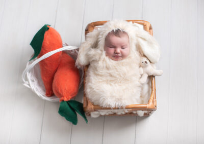 Newborn girl wearing a bunny costume