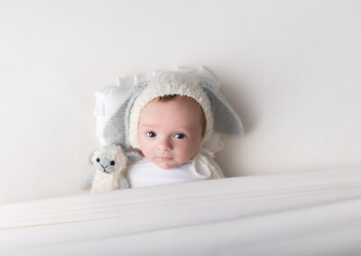 Baby wearing lamb hat